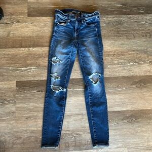 American Eagle Next Level Stretch Blue Denim Distressed Skinny Jeans